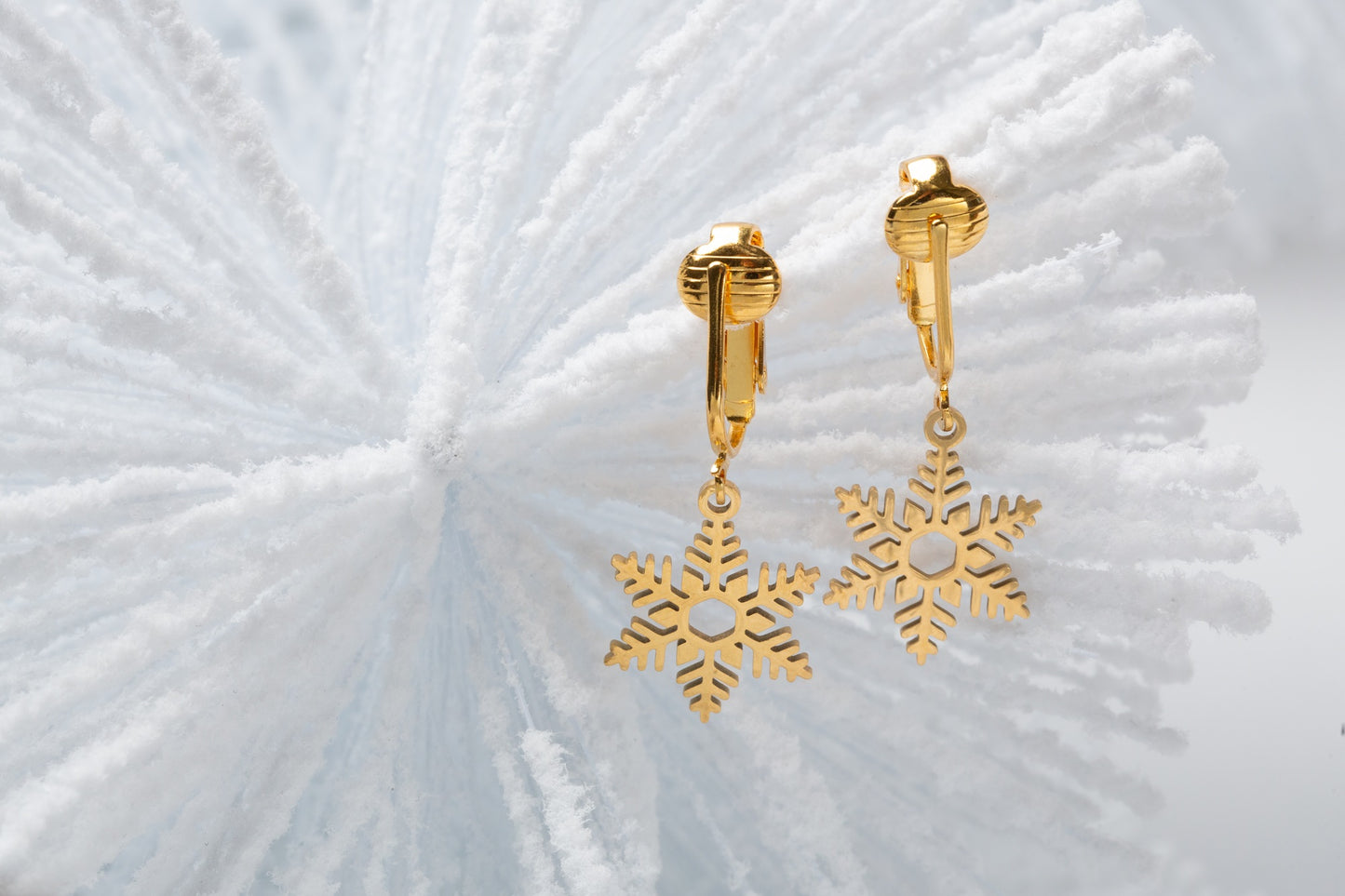 Gold Snowflake Clip On Dangling Earrings