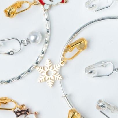 Gold Snowflake Clip On Dangling Earrings