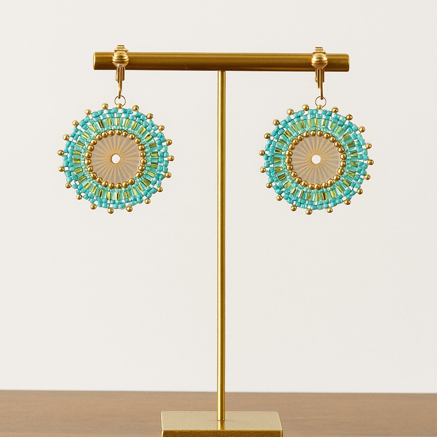 Gold Beaded Circle Clip On Dangling Earrings