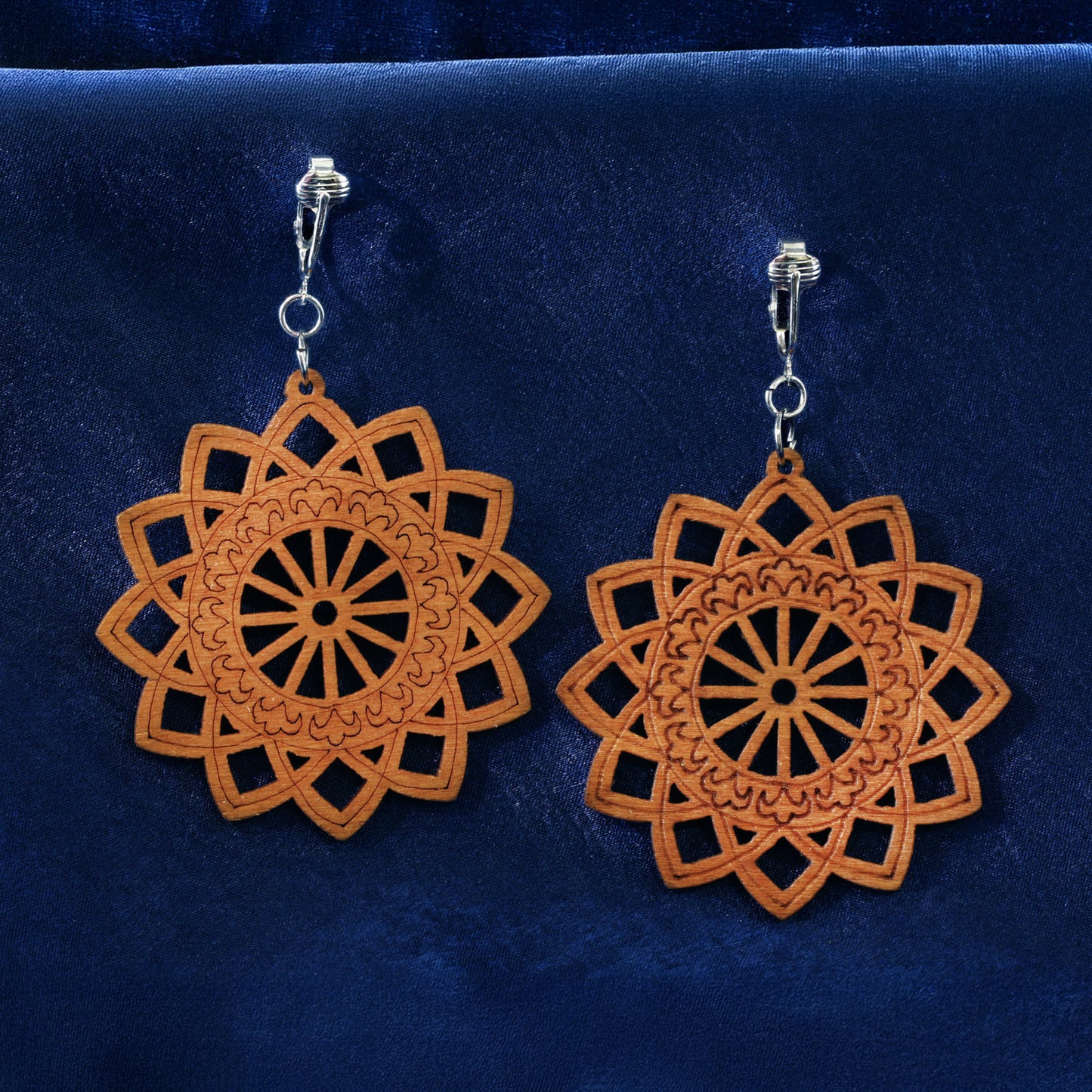 Silver Wooden Sunburst Cutouts Clip On Dangling Earrings