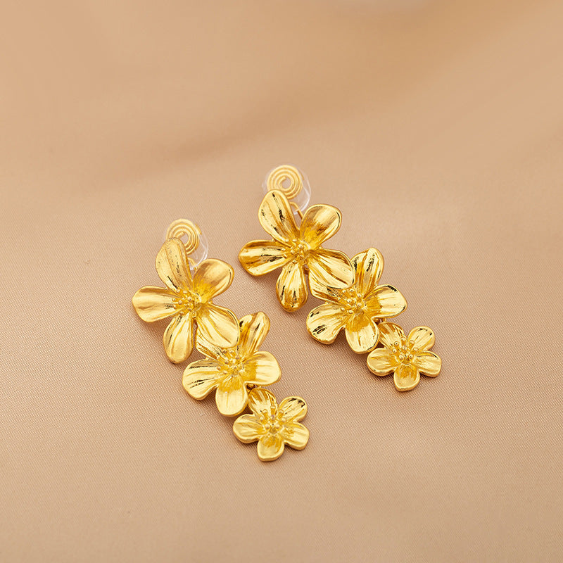 Gold Triple Flowers Mosquito Coil Clip On Dangling Earrings