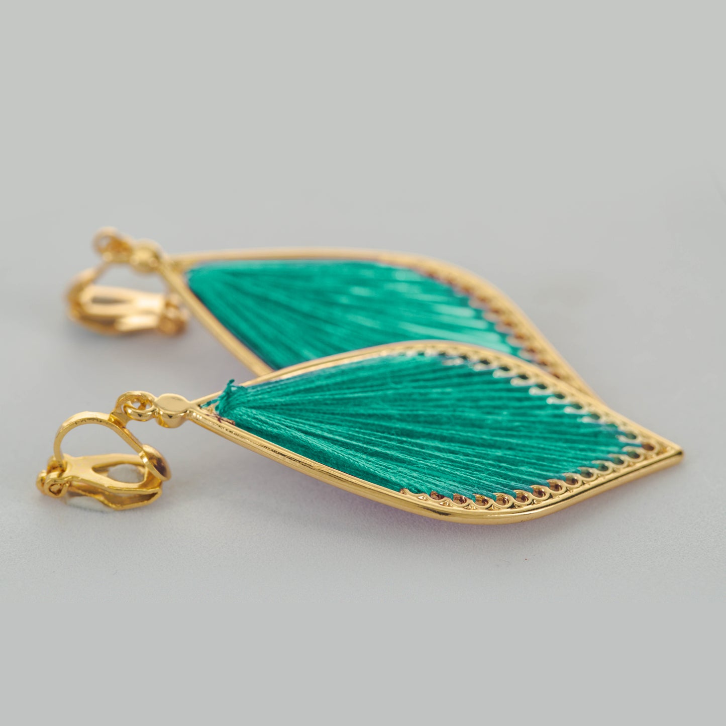 Gold Stringed Teardrop Clip On Dangling Earrings